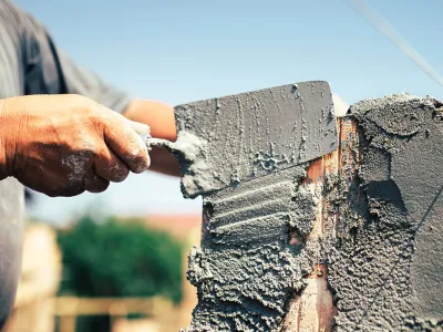 Travaux de maçonnerie générale et application de ciment par la SOCIETE DE FREITAS dans les Yvelines